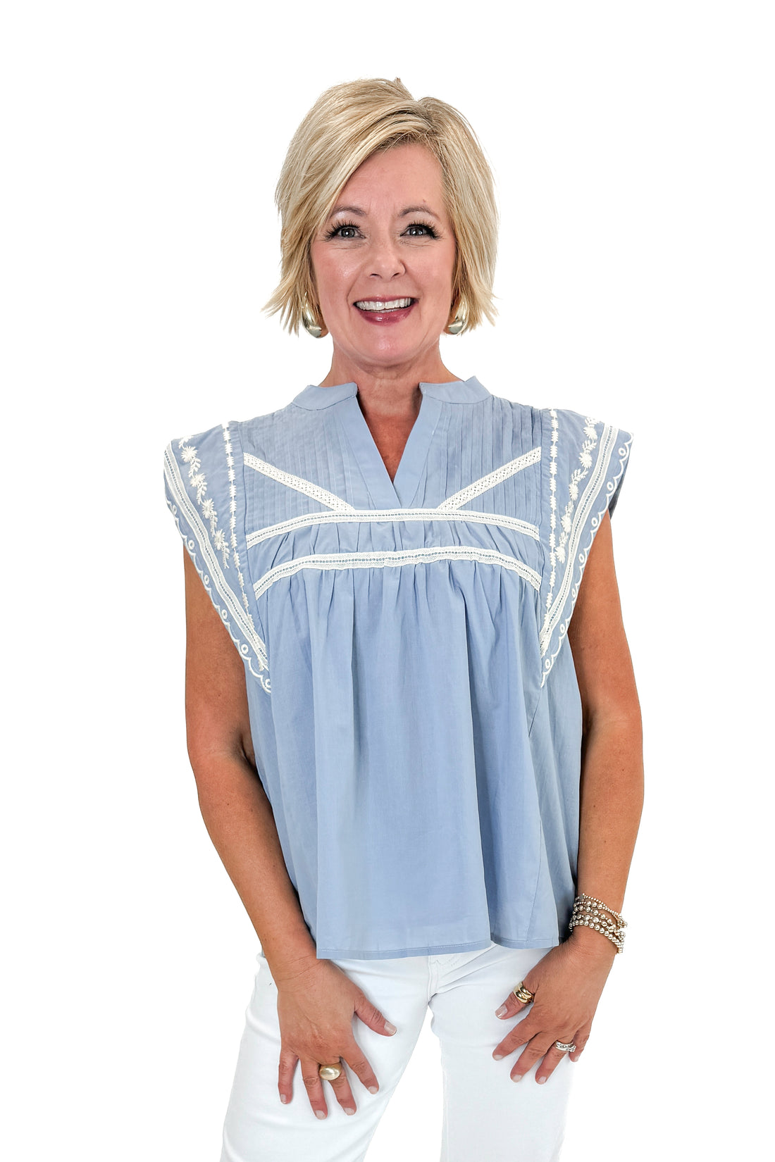 Front view of woman wearing Light Blue Embroidered Detail Top by Fate with jeans against white studio background.