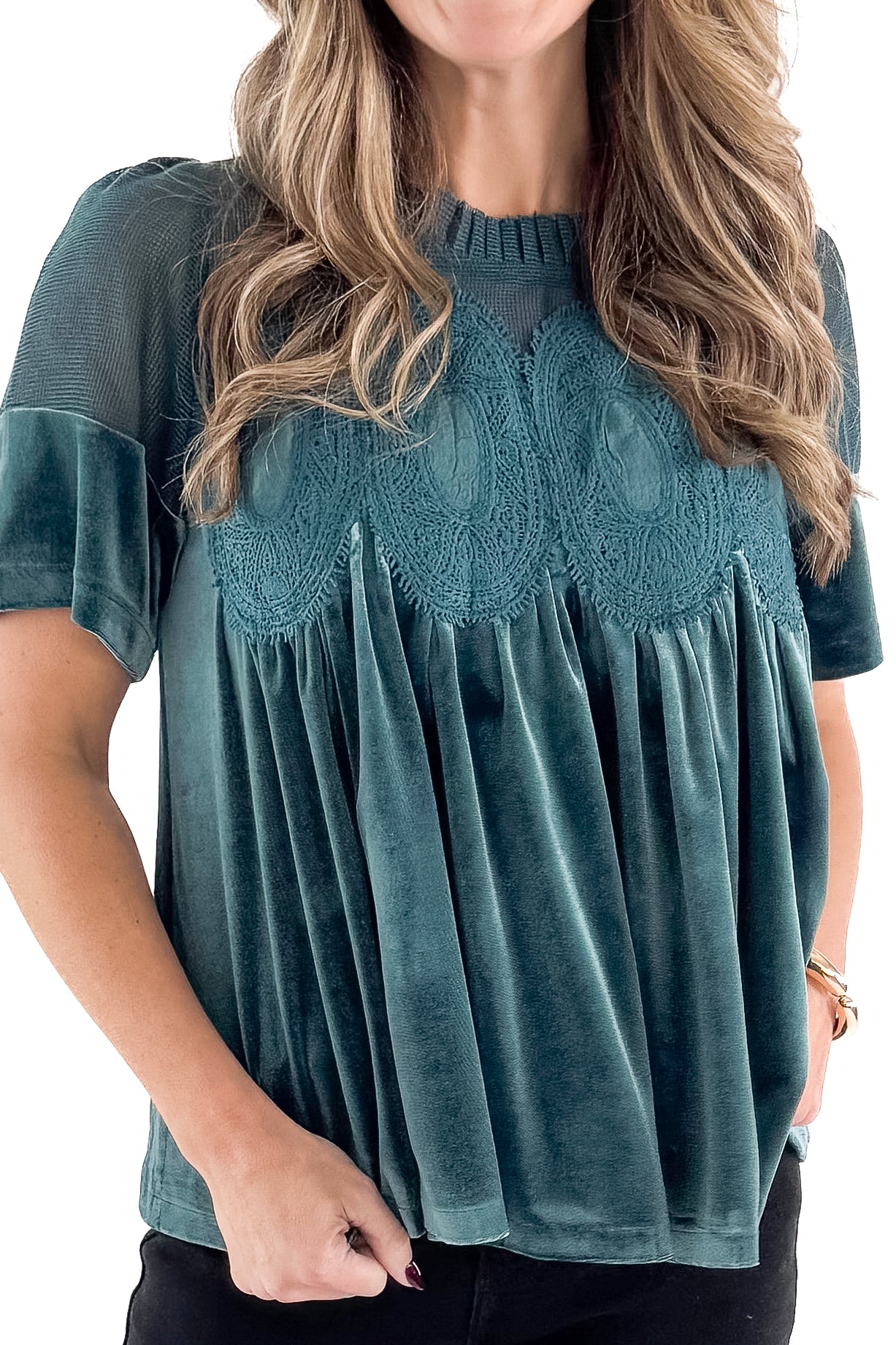 Front detailed view of woman wearing Teal Velvet With Lace Applique Top with jeans against white studio background.