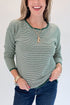 Front detail view of woman wearing Swagger Boutique’s Forest Green Striped Sweater with jeans against white studio background.