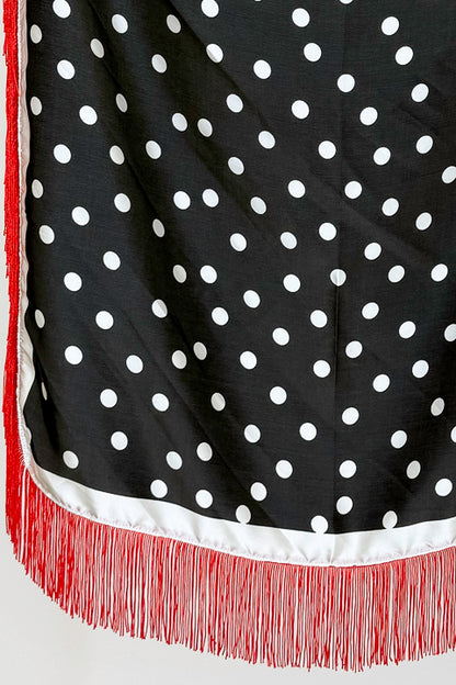 Fringe Detail Black With Polka Dots Square Scarf hanging on a rack detailed.