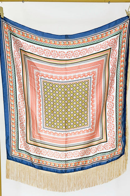 A square scarf with a complex geometric and floral border pattern, featuring a central olive-green patterned square, coral and pink borders, and a blue outer border with gold fringe.