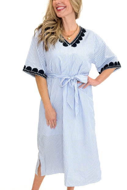 Front view of woman wearing Blue Striped Embroidery Accent Midi Dress with sandals against white studio background.