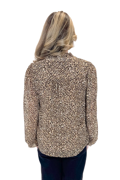Back view of woman wearing Leopard V-neck With Metallic Detail Top with jeans against white studio background.