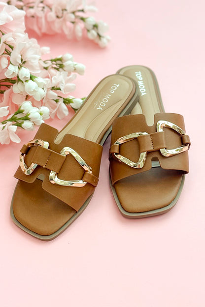 Front view of Gelato- Tan Buckle Detail Sandals against pink studio background.