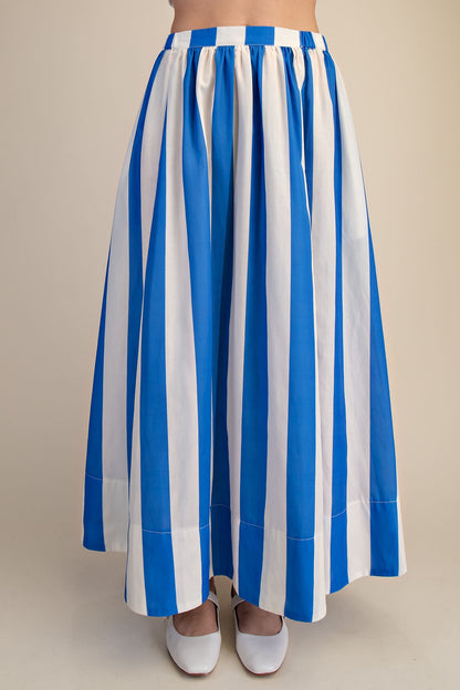 Front view of woman wearing Blue &amp; White Striped Skirt against studio background.