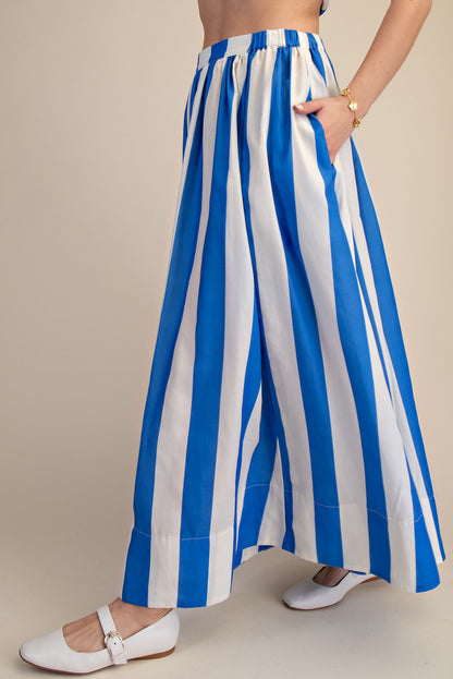 Side view of woman wearing Blue &amp; White Striped Skirt against studio background.