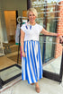 Front view of woman wearing Blue & White Striped Skirt with sweater at Swagger Boutique.