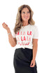 Front view of woman wearing Sea Salt Falalala Boyfriend Tee by Z Supply with skirt against white studio background.