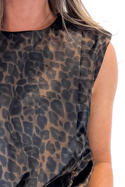 Front detail view of woman wearing Leopard Satin Sleeveless Top with jeans against white studio background.