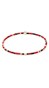 A beaded bracelet with alternating red and black beads, accented by small gold spacer beads and a central gold disc clasp, shown on a plain white background.