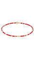 A gold and red beaded stretch bracelet with polished spherical beads, displayed on a clean white background.