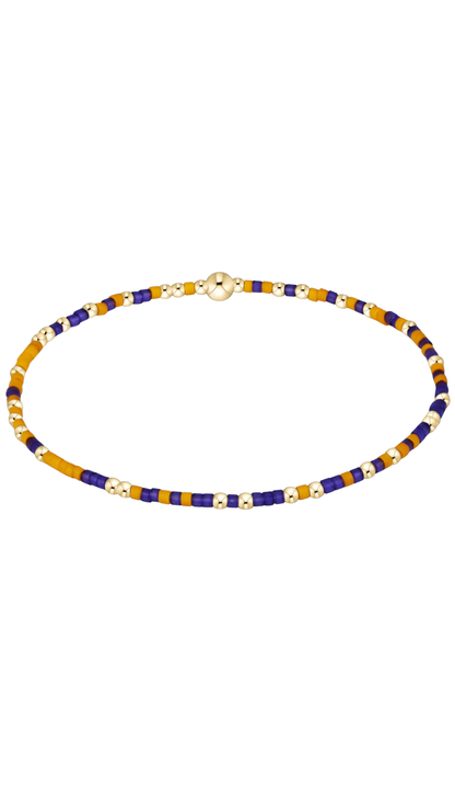 Closeup shot of enewton purple and yellow beaded bracelet