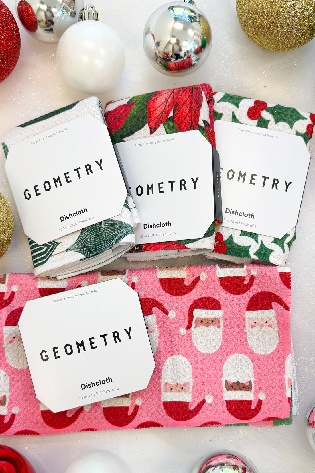 Geometry Festive Holly Dishcloth Set against holiday background.