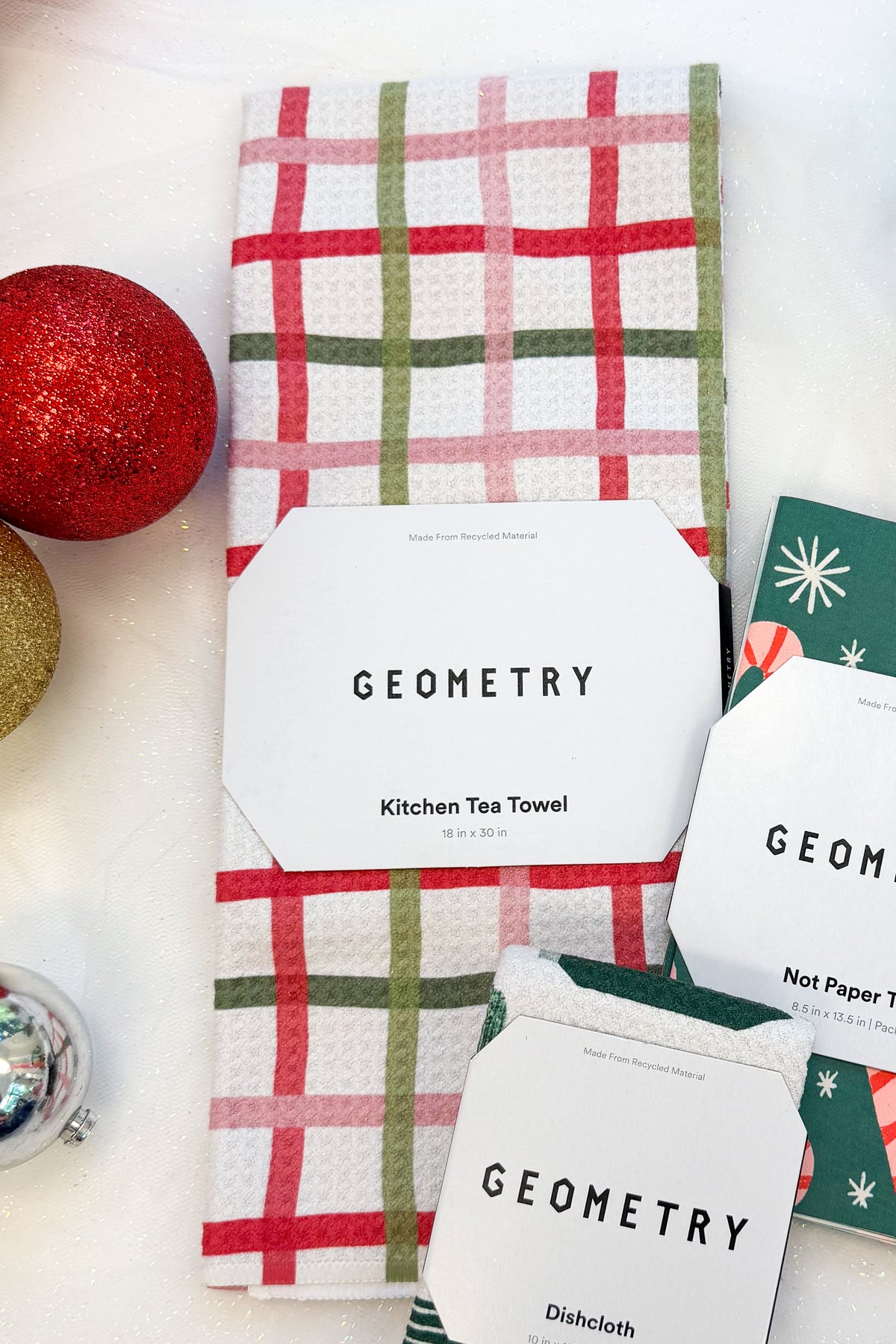Geometry Festive Plaid Microfiber Tea Towel against holiday background.