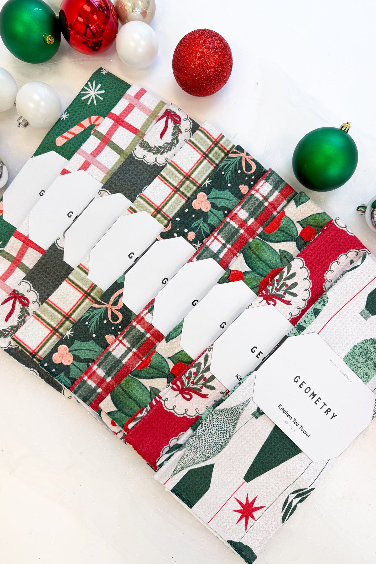 Geometry Sweet Candy Microfiber Tea Towel against holiday background.