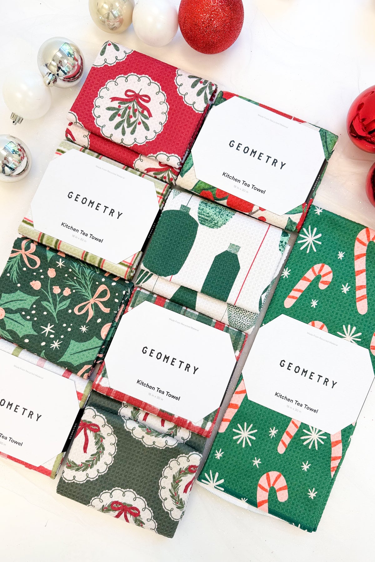 Geometry Merry Mistletoe Microfiber Tea Towel against holiday background.