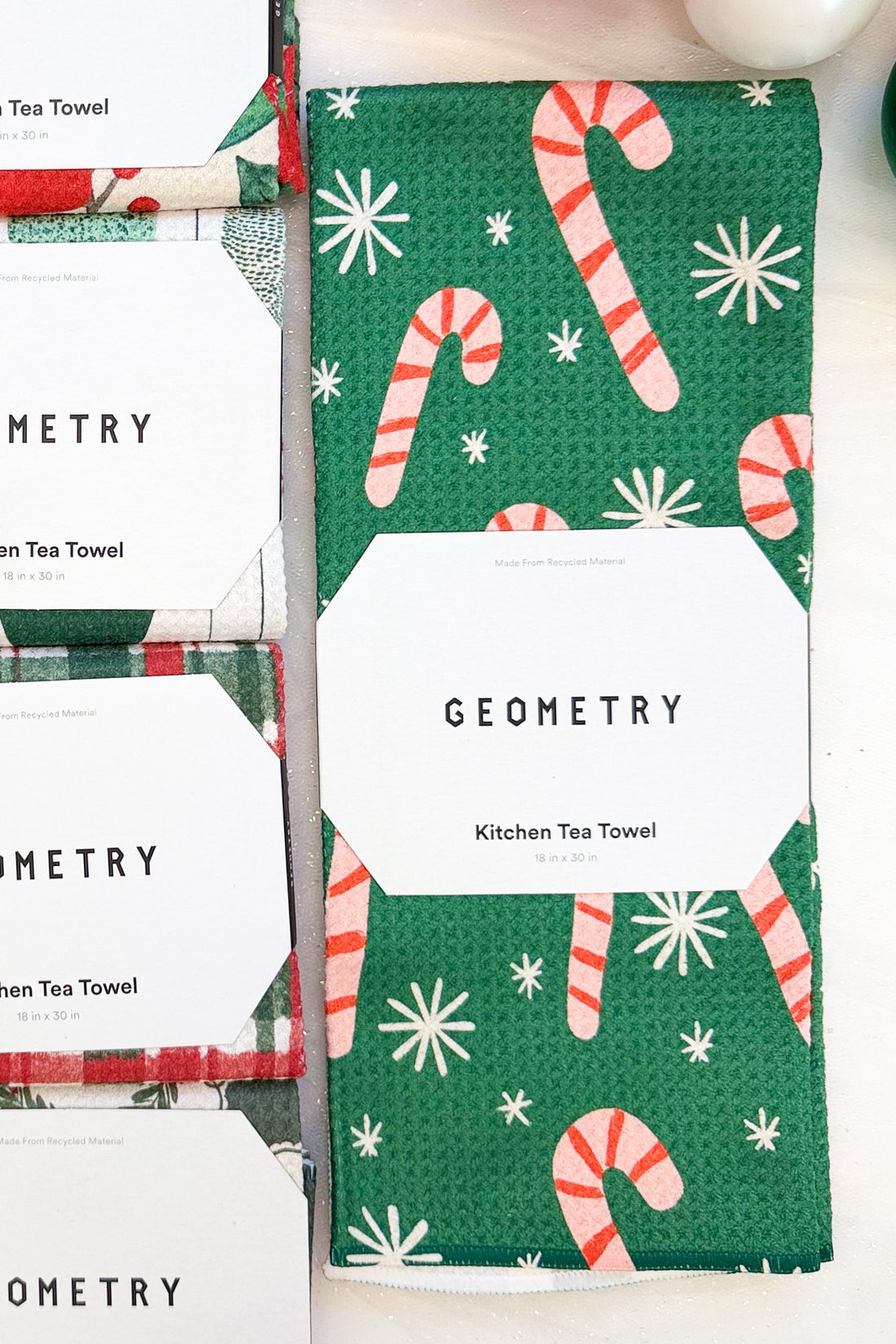 Geometry Sweet Candy Microfiber Tea Towel against holiday background.