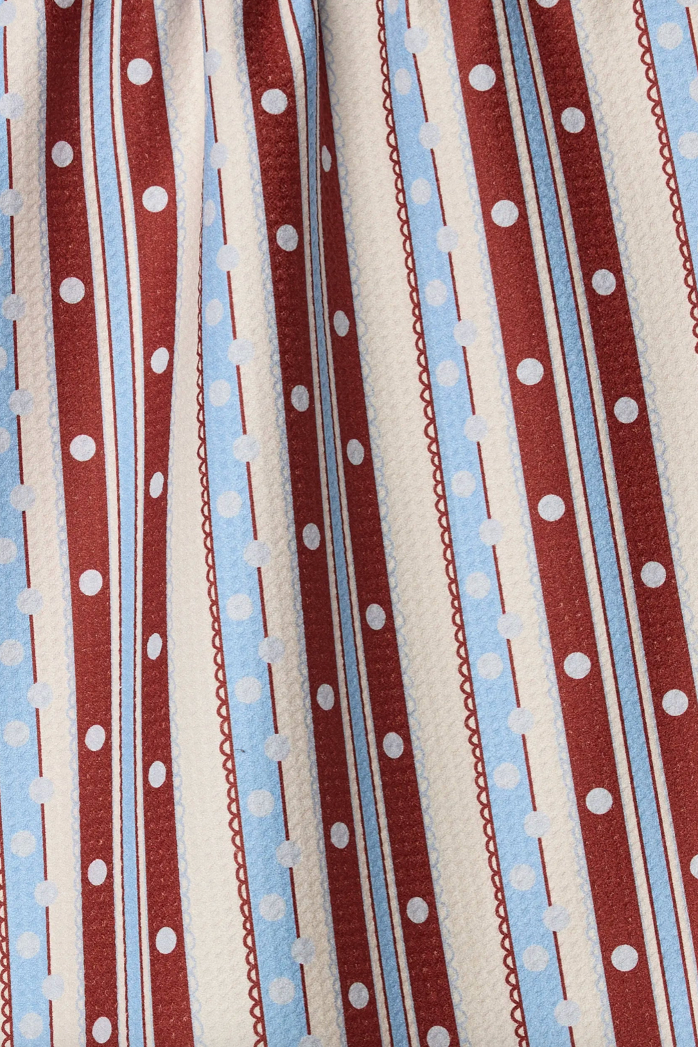 Fabric with red, blue, and white striped pattern