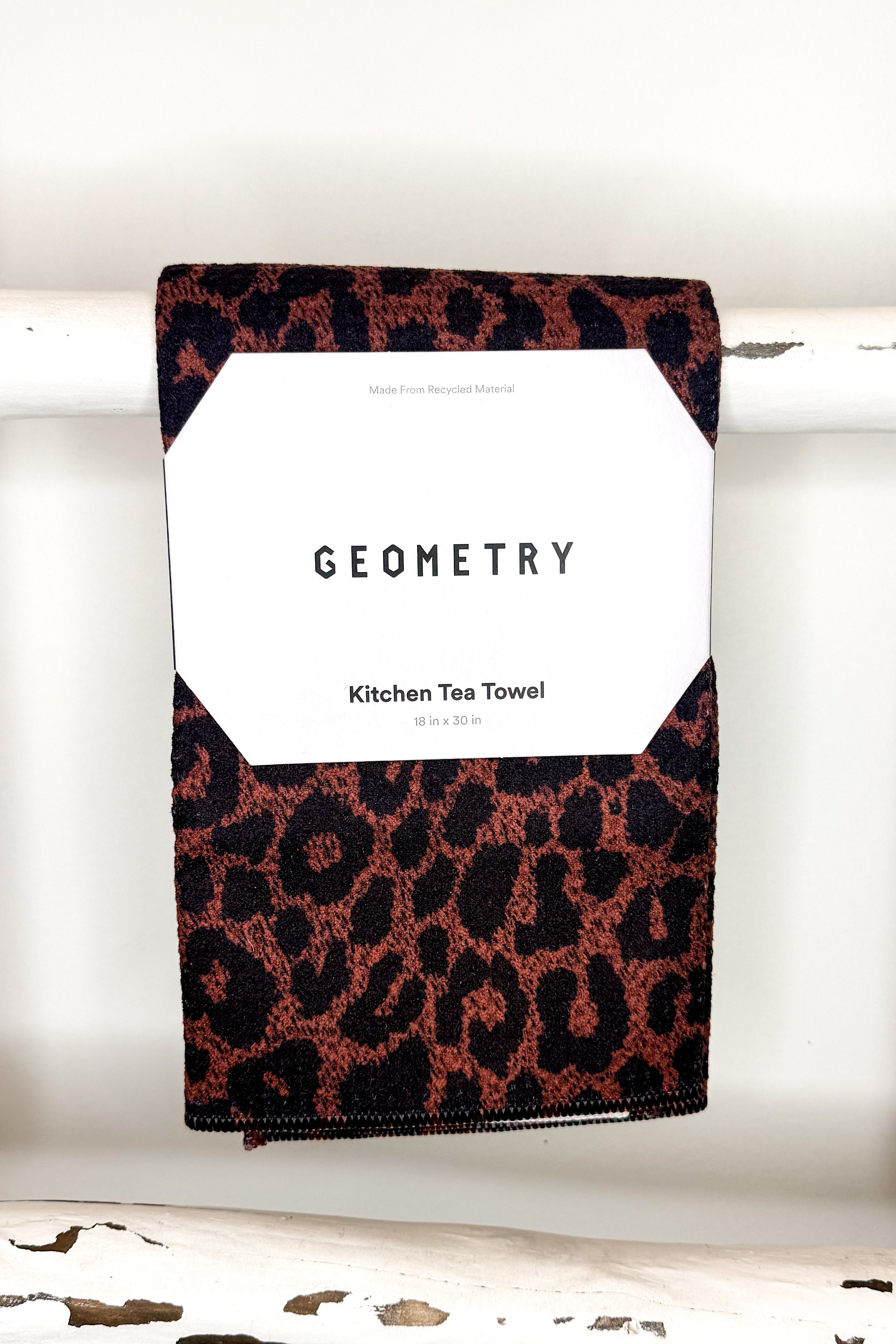 Geometry Midnight Safari Microfiber Tea Towel on ladder