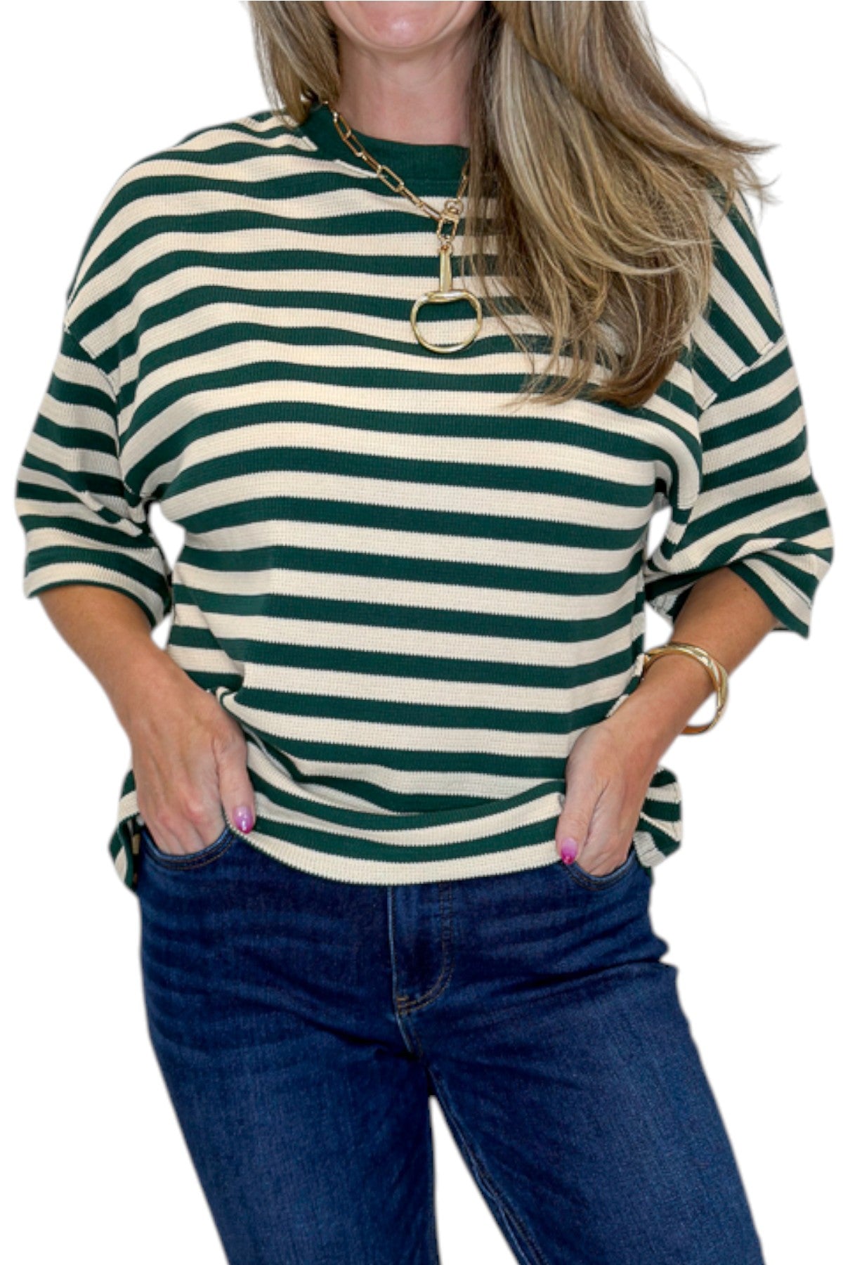 Front detail view of woman wearing Swagger Boutique’s Green &amp; Cream Striped Textured Tee by Entro with jeans against white studio background.
