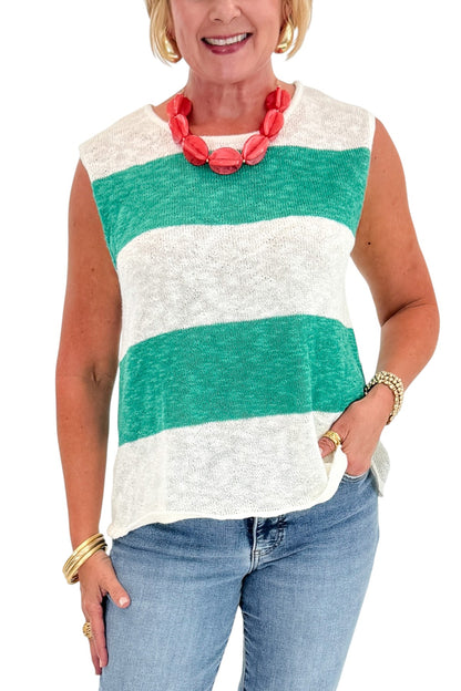 Front detail view of woman wearing Swagger Boutique’s Green &amp; White Striped Sleeveless Sweater with jeans against white studio background.