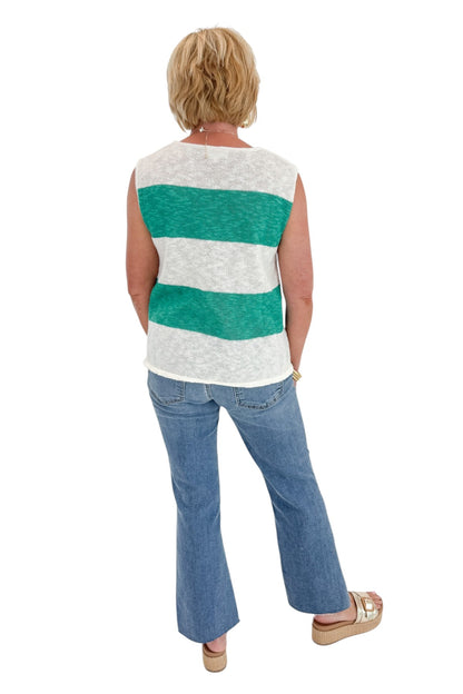 Back view of woman wearing Swagger Boutique’s Green &amp; White Striped Sleeveless Sweater with jeans against white studio background.