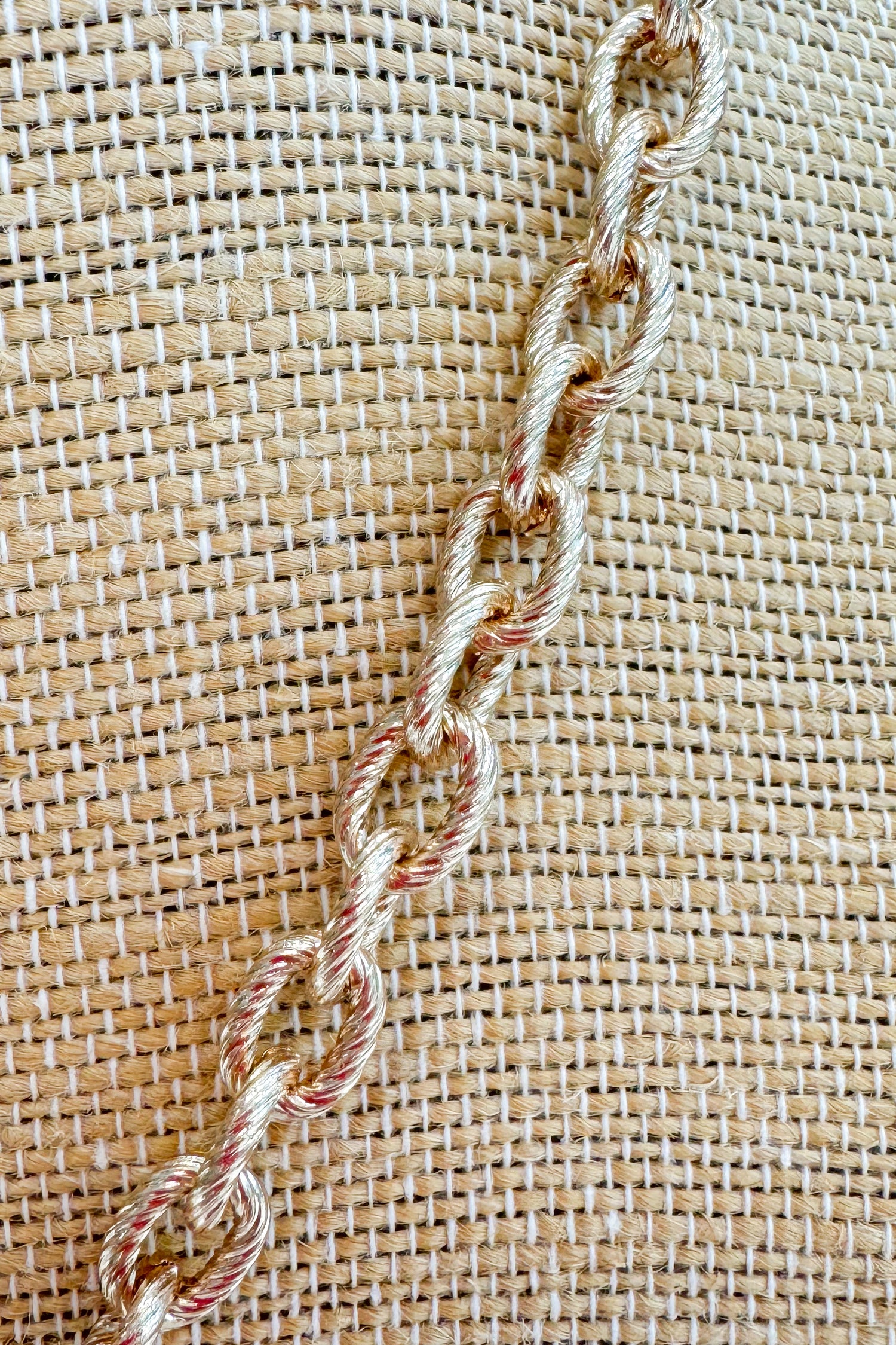 Close-up of chain on fabric