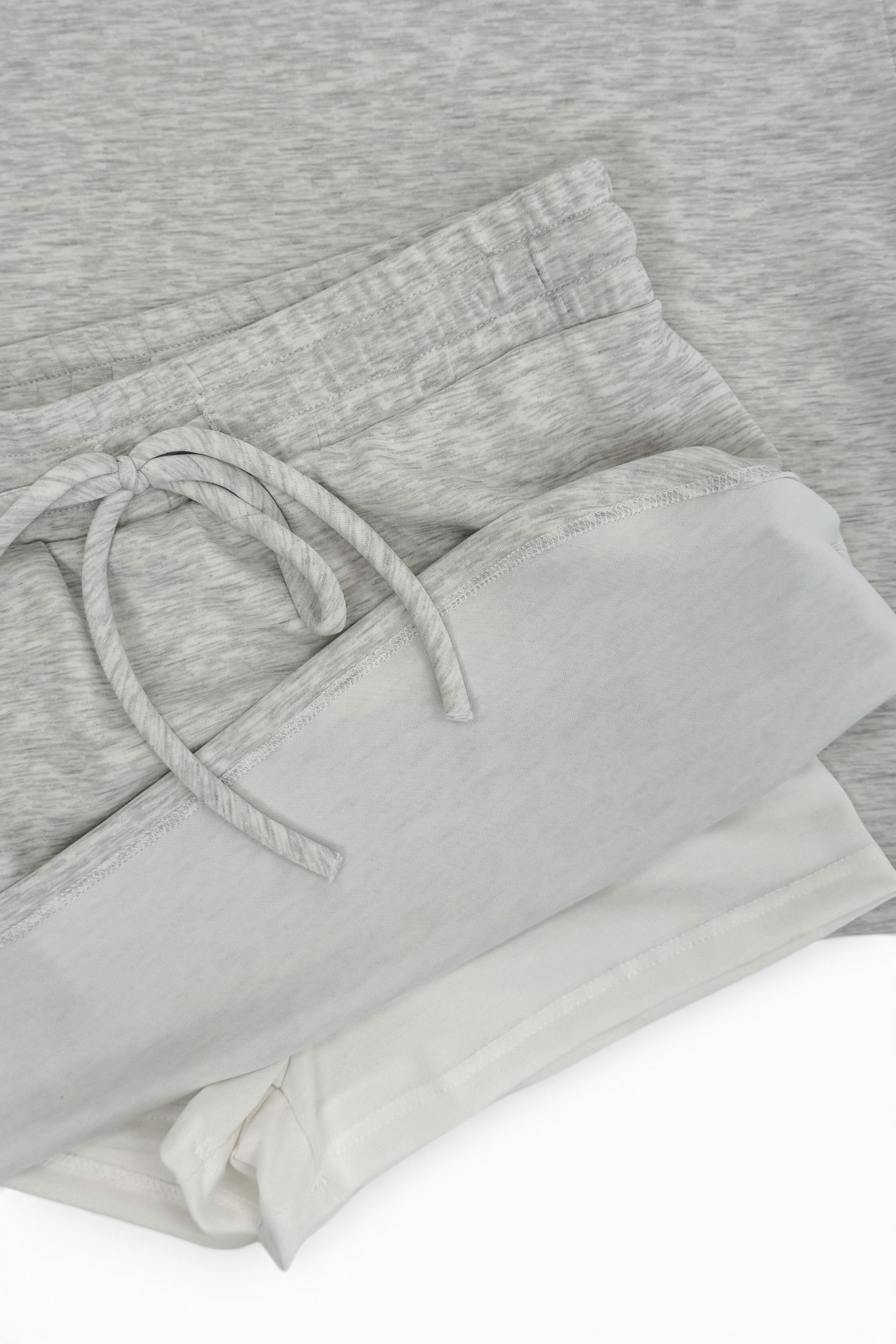Grey Round Neck Short Sleeve Top with matching Grey Skort showing shorts against white studio background.