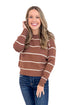 Woman wearing Dreamy Days Brown & Cream Striped Sweater - front view showing classic crew neckline and horizontal stripe pattern.