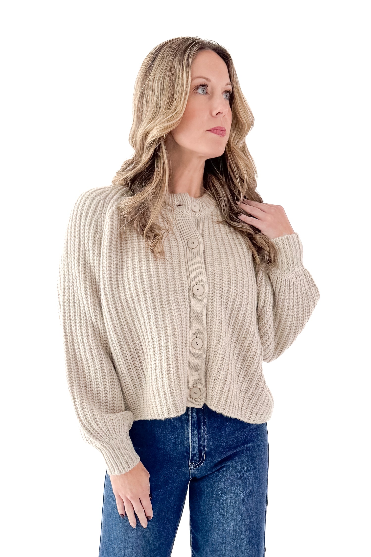 Front view of woman wearing Light Mocha Button Up Cardigan with jeans against white studio background.