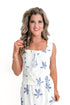 Front view of woman wearing White With Blue Embroidery Top with matching skirt against white studio background.