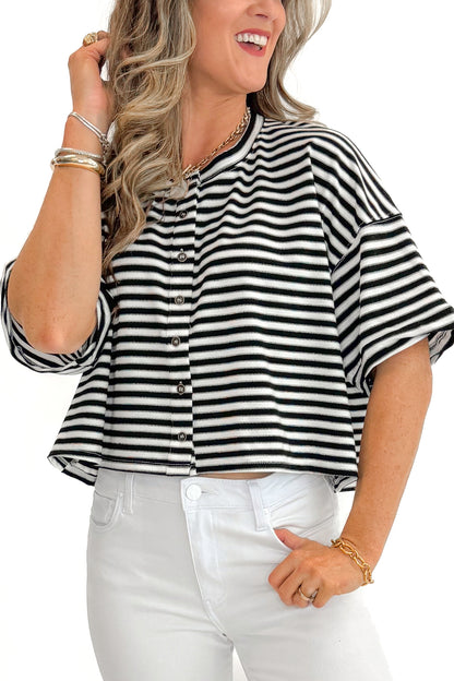 Front detail view of woman wearing Black &amp; White Striped Button Up Tee with jeans against white studio background.