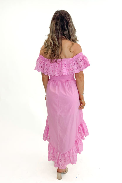 Back view of woman wearing Pink Eyelet Detail Hi-Low Dress against white studio background.