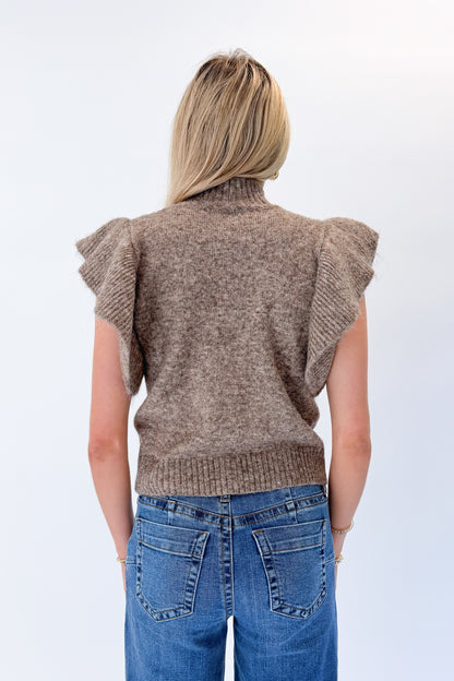 Back view of woman wearing Swagger Boutique’s Heathered Taupe Short Flutter Sleeve Sweater by Entro with jeans against white studio background.