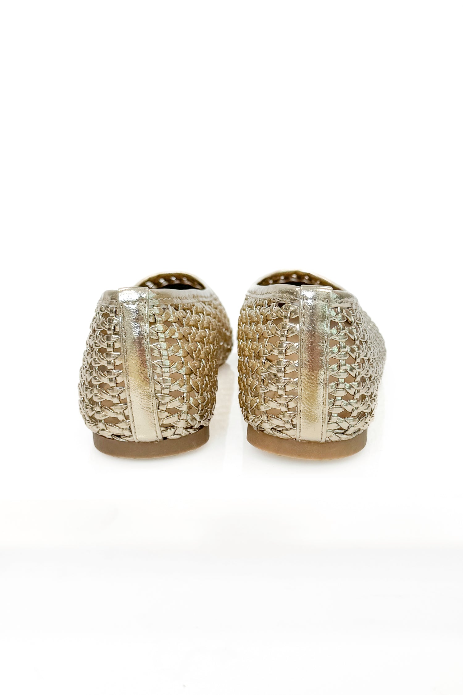 Swagger Boutique’s sweater Highway- Gold Woven Flats against white studio background.
