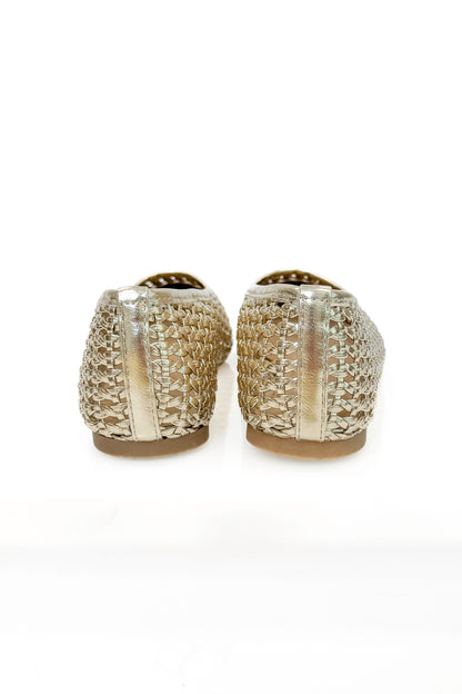 Swagger Boutique’s sweater Highway- Gold Woven Flats against white studio background.