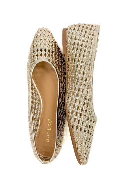 Swagger Boutique’s sweater Highway- Gold Woven Flats against white studio background.