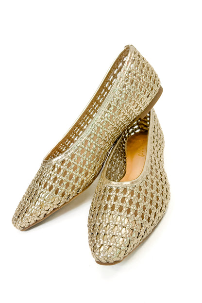 Swagger Boutique’s sweater Highway- Gold Woven Flats against white studio background.