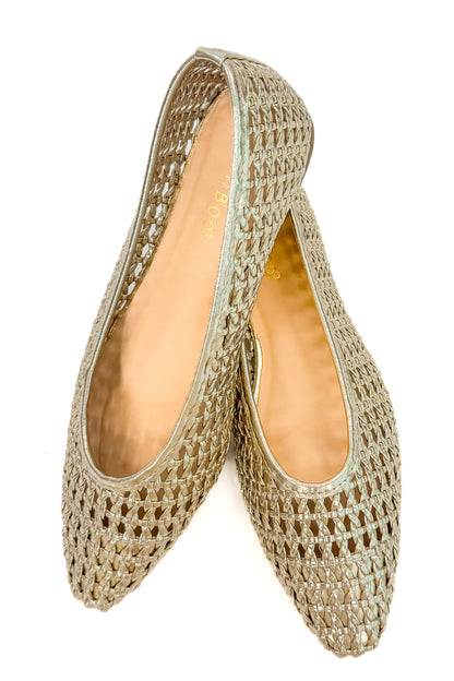 Swagger Boutique’s sweater Highway- Gold Woven Flats against white studio background.
