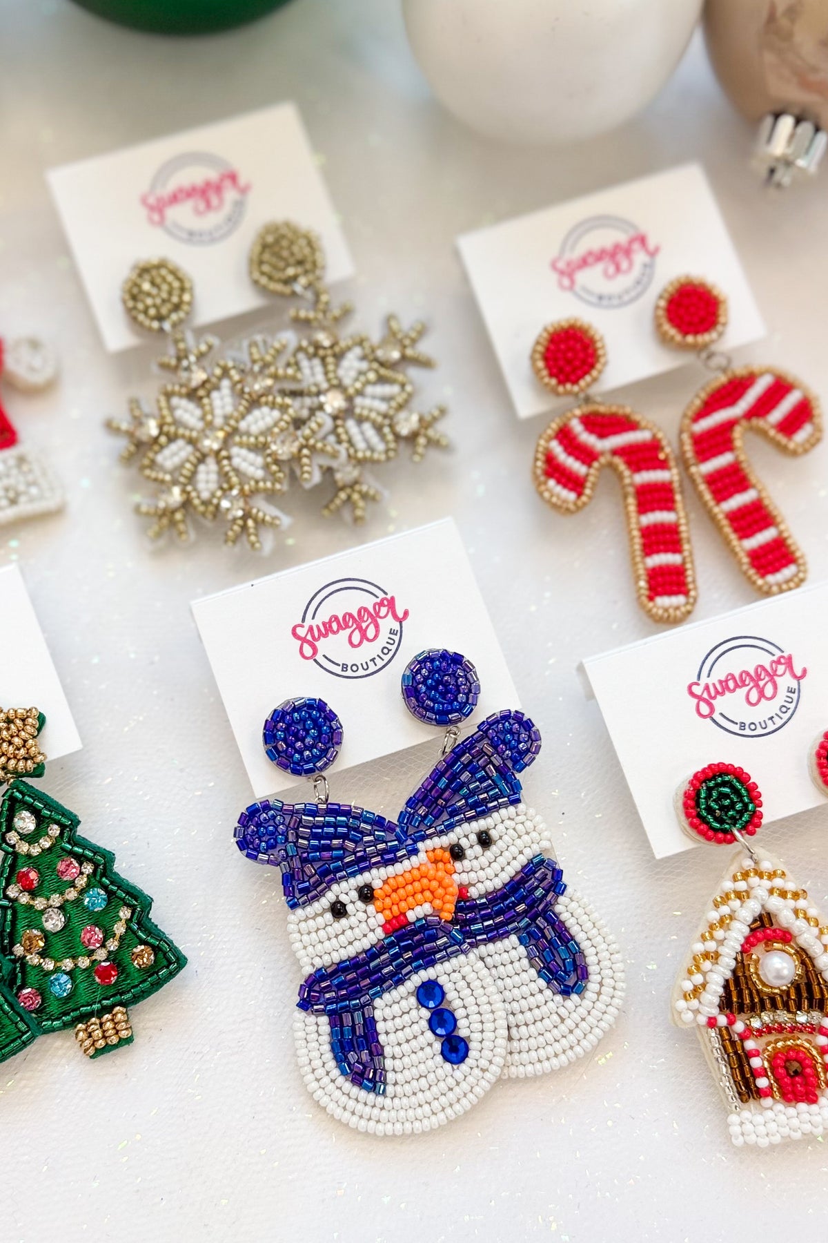 Holiday Spirit Earrings against holiday background.