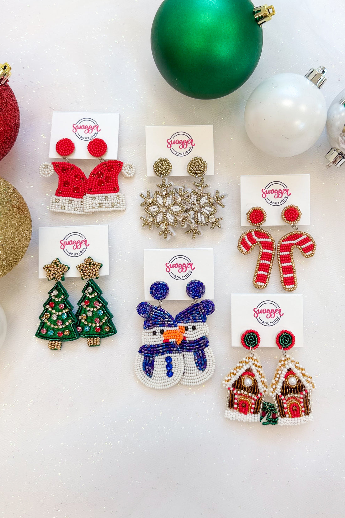 Holiday Spirit Earrings against holiday background.