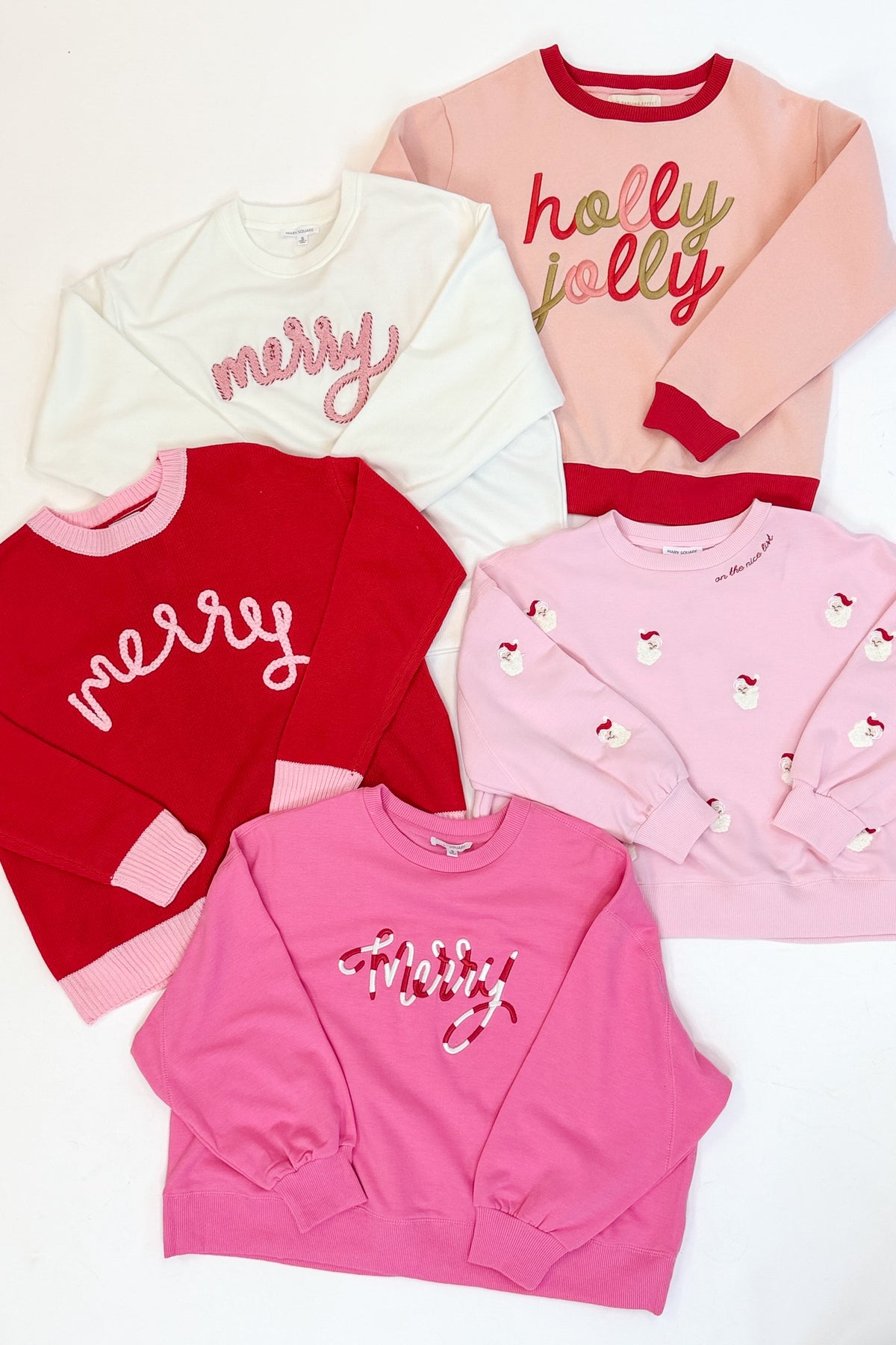 Swagger Boutique’s Holiday Sweatshirts against a white studio background.