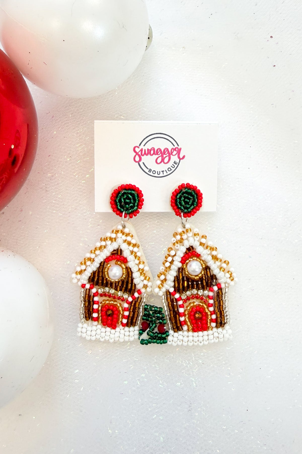 Holiday Spirit Earrings Gingerbread against holiday background.