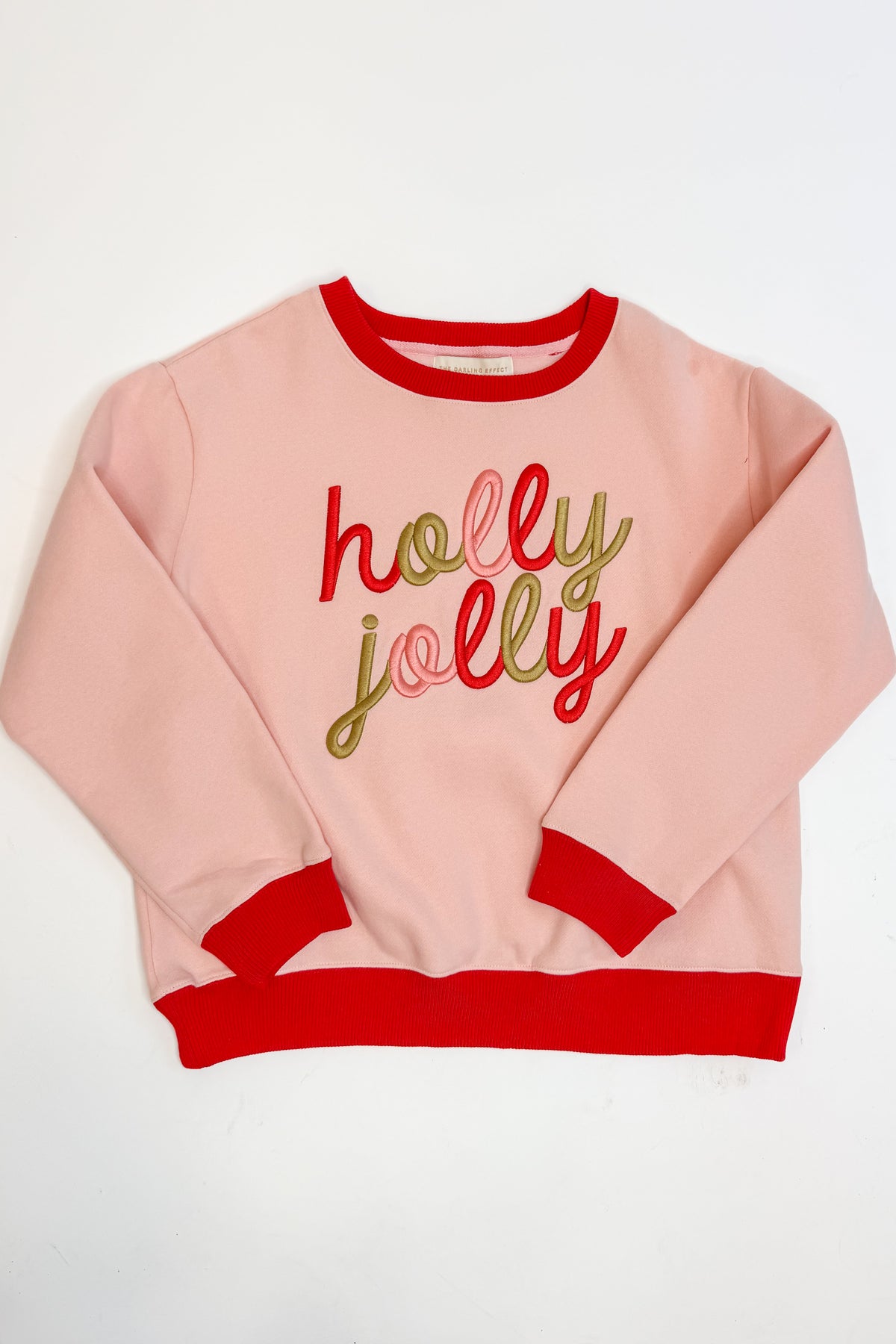Swagger Boutique’s Holly Jolly Signature Crew Sweatshirt against white studio background.