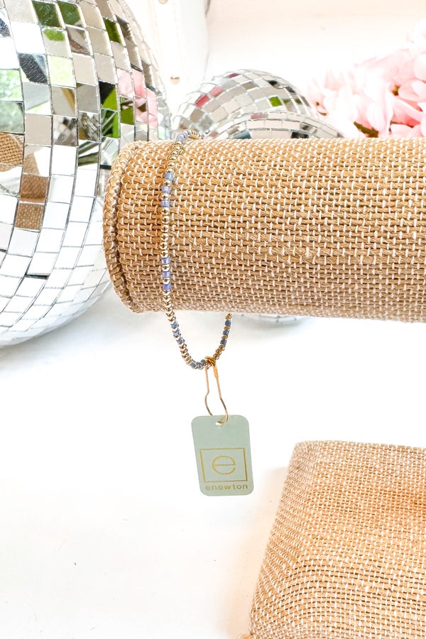 Bracelet with a tag on a textured surface