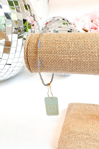 Bracelet with a tag on a textured surface