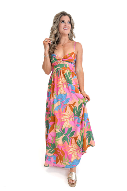Front view of woman wearing Multi Tropical Printed Maxi Dress against white studio background.