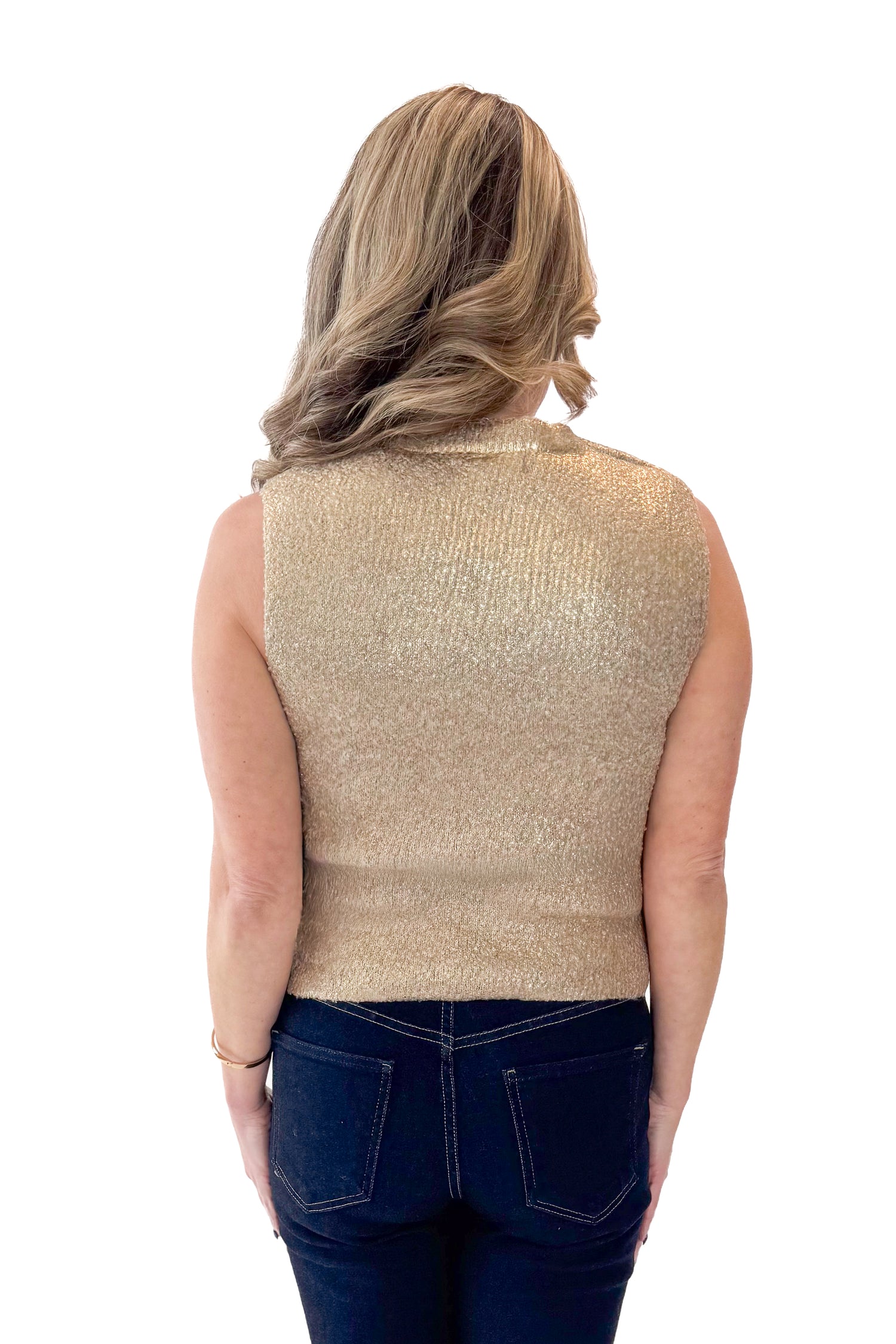 Back view of woman wearing Gold Sleeveless Sweater with jeans against white studio background.