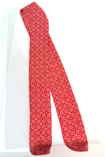 Red and white patterned scarf on a white background