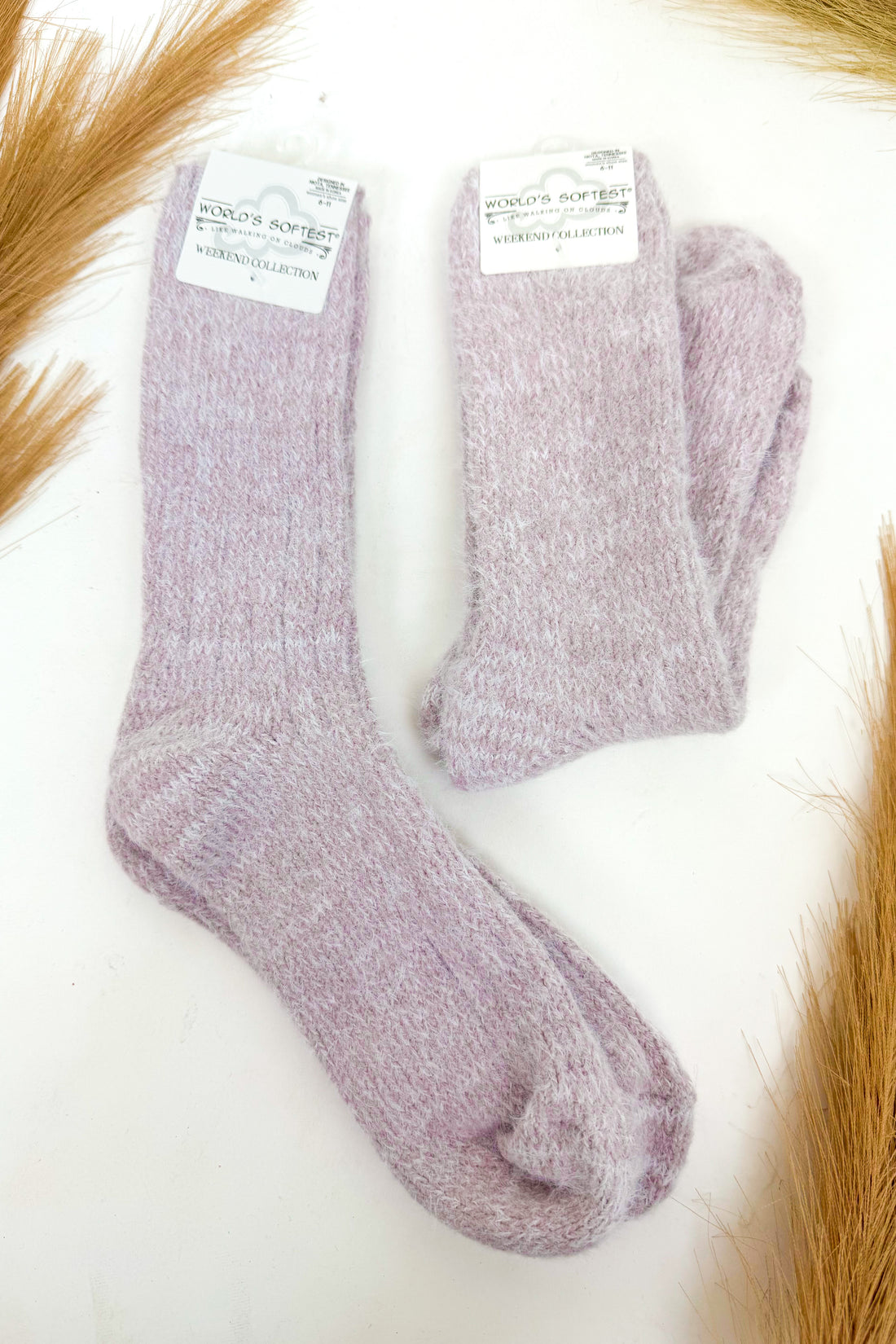 light purple plush socks against a white background